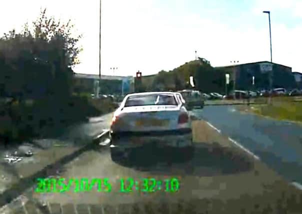 Dashcam video appears to show a police van turning right at a red light