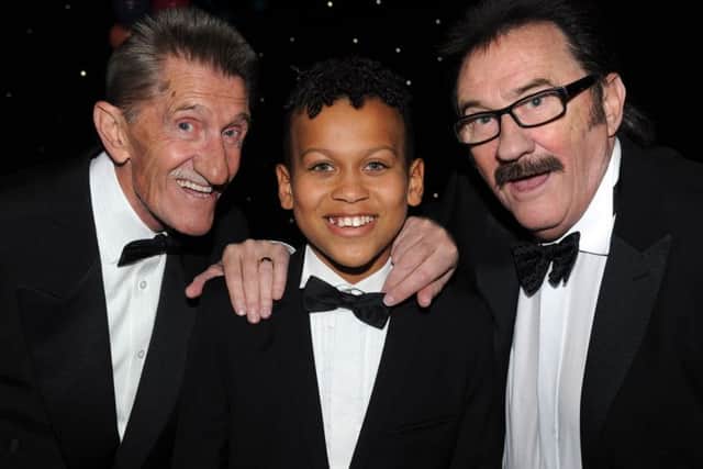 Sports achievement winner Junior Frood with Chuckle Brothers Barry and Paul at the Yorkshire Children of Courage Awards.