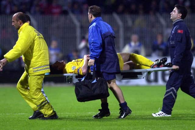 Leeds United's Michael Bridges is carried off the pitch after a clash with Besiktas's Bozkurt Umit.