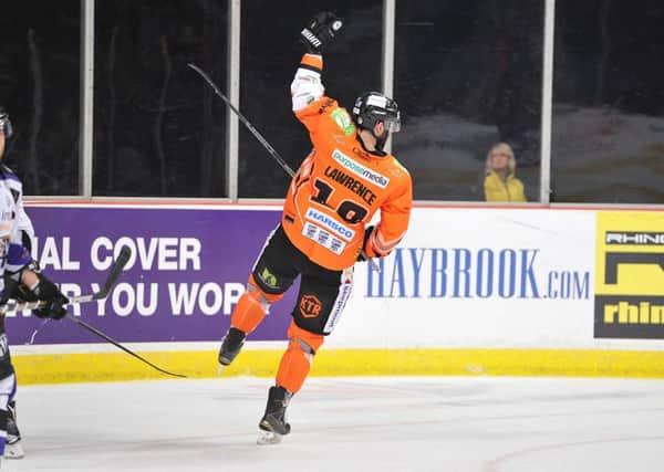 TARGET MAN: Chris Lawrence skates away in celebration after scoring against Braehead Clan in a 4-3 overtime victory at Sheffield Arena on Subnday night. Picture: Dean Woolley.