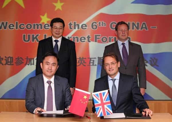 Rear, from left: Zhuang Rongwen, vice minister of the cyberspace administration of China and digital minister, Ed Vaizey, Front: Zhang Chunhui, general manager of Carsmart and Aldo Monteforte, co-founder & director at The Floow.