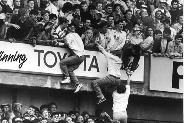 15th April 1989

The Hillsborough disaster at Sheffield Wednesday's ground.

The match was an FA cup semi final between Liverpool and Nottingham Forest.

Liverpool fans scramble upwards from the crush on the Leppings lane terrace.