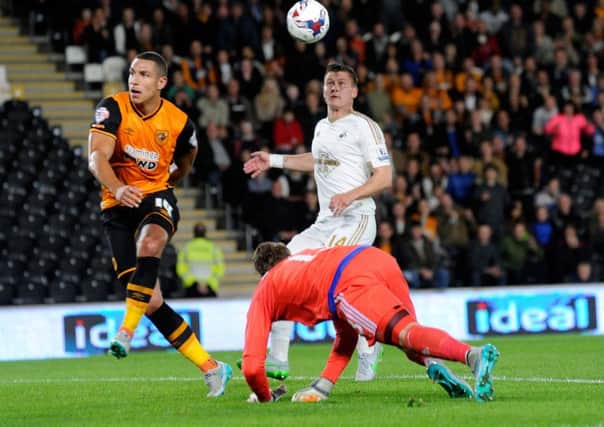 Hull City's Jake Livermore pictured playing against Swansea City (Picture: Bruce Rollinson).