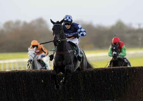 Menorah and Richard Johnson jump the last fence and go on to win the Charlie Hall Chase at Wetherby (Picture: PA).