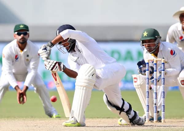 England's Adil Rashid plays a shot during the Pakistan and England Test match at the Dubai International Stadium in Dubai.