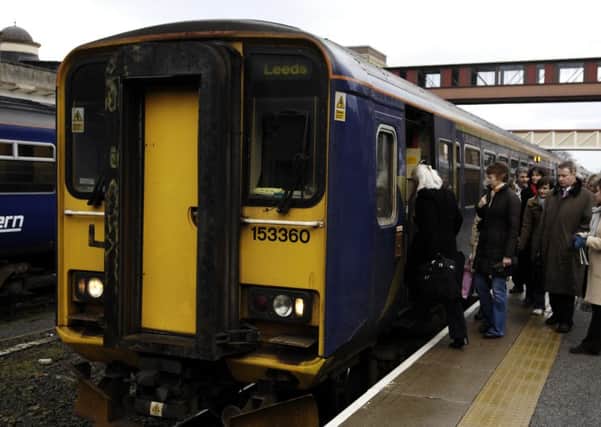 Commuters squeeze on to an ageing carriage at Harrogate Station