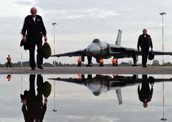 Members of the crew of Vulcan XH558, a restored nuclear bomber, walk from the aircraft after its final flight at Doncaster's Robin Hood Airport.