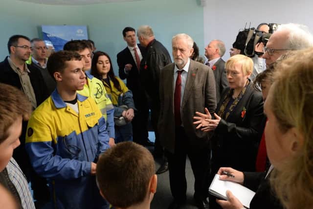 Labour Party leader Jeremy Corbyn (centre) and Shadow Business Secretary Angela Eagle (right) talk to steelworkers and their families during a visit to Tata Steel's Scunthorpe site. PRESS ASSOCIATION Photo. Picture date: Thursday October 29, 2015. Thousands of job cuts have been announced by Tata Steel and SSI in Redcar, Scunthorpe and Scotland in recent weeks, with cheap imports and high energy and emissions costs being blamed. See PA story POLITICS Steel. Photo credit should read: Anna Gowthorpe/PA Wire