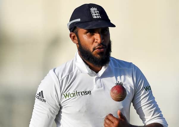 England's Adil Rashid leaves field after his five-wicket haul during the final day of first test match between Pakistan and England at Zayed Cricket Stadium in Abu Dhabi, United Arab Emirates. (AP Photo/Hafsal Ahmed)