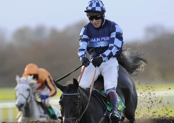 Menorah and Richard Johnson jump the last fence as they go on and win the bet365 Charlie Hall Chase during the Charlie Hall Chase day at Wetherby Racecourse. (Picture: John Giles/PA Wire)