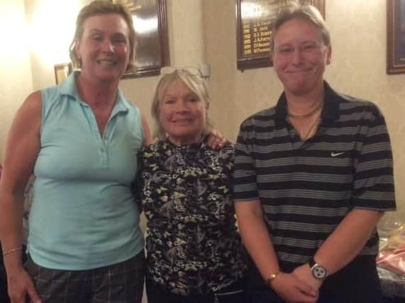 Winners Heather Staniforth, left, and Jayne Helliwell, right, with Huddersfield GC ladies captain Jean Gee.
