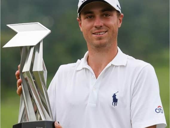 Justin Thomas with the trophy after winning the CIMB Classic at Kuala Lumpur Golf and Country Club (Picture: Joshua Paul/AP).