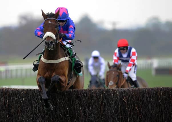 Cue Card and Paddy Brennan jump the final fence as they go on to win the bet365 Charlie Hall Chase during day two of the bet365 Charlie Hall Meeting at Wetherby Racecourse. (Picture: John Giles/PA Wire)