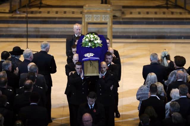 The coffin of Pc Dave Phillips is carried out of Liverpool's Anglican Cathedral