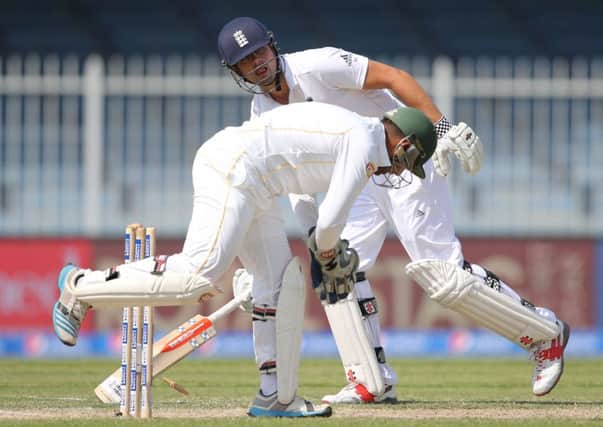 Englands captain Alastair Cook makes his ground during the third Test against Pakistan in Sharjah on his way to making 49 (Picture: Kamran Jebreili/AP).