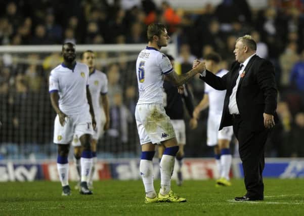 NICE ONE: Steve Evans congratulates Liam Cooper after Leeds United's victory over Cardiff City at Elland Road. PIC: Bruce Rollinson