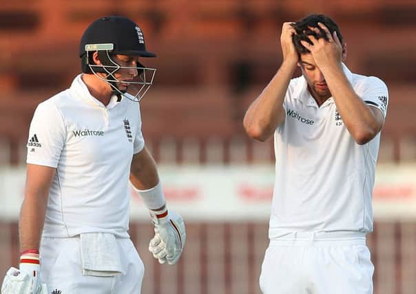 England and Yorkshire's Joe Root, left, and Alistair Cook take a moment as they contemplate pulling off a record run chase for their team in Asia in order to square the Test series with Pakistan. Picture: AP/Kamran Jebreili.