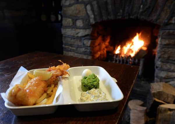 Beer battered fish and chips with minted crushed peas, tartar sauce, at the Stone Trough Inn at Kirkham.