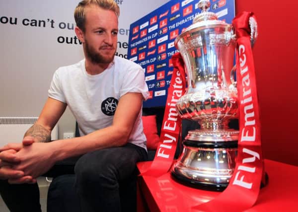 Doncaster Rovers' James Coppinger gazes at the FA Cup ahead of his side's tie with Stalybridge Celtic (Picture: Scott Merrylees)..