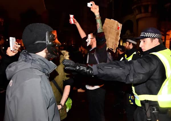 Protestors demonstrate in central London, during the Million Mask March bonfire night protest organised by activist group Anonymous. PRESS ASSOCIATION Photo. Picture date: Thursday November 5, 2015. The London protest is one of many similar marches held worldwide on November 5. Its agenda is broadly anti-capitalism and pro-civil liberty. See PA story POLICE Anonymous. Photo credit should read: Dominic Lipinski/PA Wire