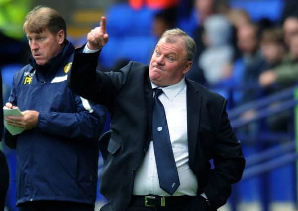 Leeds United manager Steve Evans is excited about the derby with Huddersfield Town but took time out to commiserate with Chris Powell over his sacking.