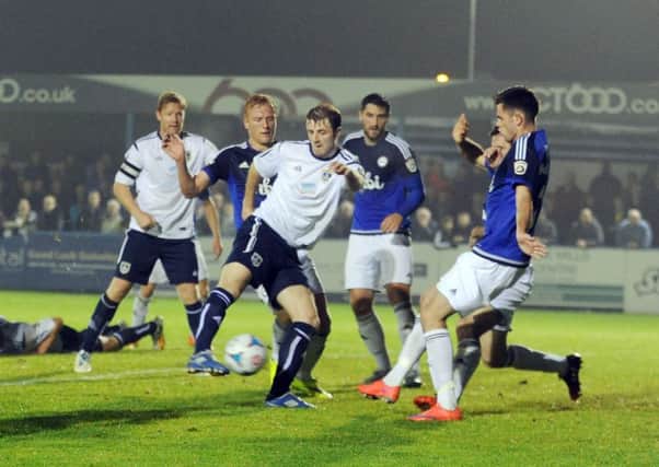 Adam Boyes scores for Guiseley in their FA Cup replay against local rivals Halifax.