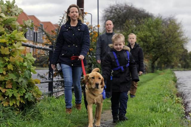 The Hadfield family with support dog Azerley: Mum and dad Sarah and Chris Hadfield, with Cohen, seven, and older brother Joshua.

Picture: Bruce Rollinson
