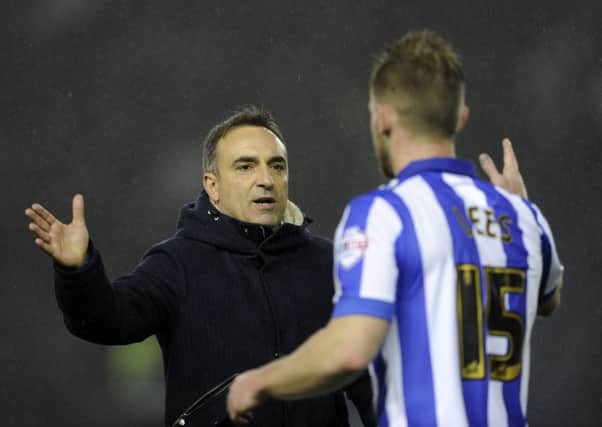 Owls head coach Carlos Carvalhal with Tom Lees