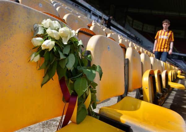 A bunch of white roses in the stand at Valley Parade on the day of the 30th anniversary of the Bradford City fire memorial service, Centenary Square, Bradford.  11 May 2015.  Picture Bruce Rollinson
