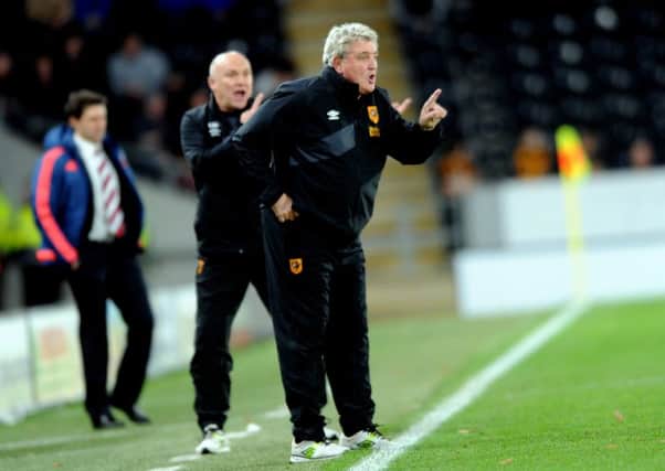City's manager Steve Bruce gives out the orders.