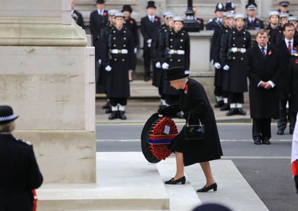 Queen Elizabeth II lays a wreath during the annual Remembrance Sunday service at the Cenotaph memorial in Whitehall, central London, held in tribute for members of the armed forces who have died in major conflicts. PRESS ASSOCIATION Photo. Picture date: Sunday November 8, 2015. See PA story MEMORIAL Remembrance. Photo credit should read: Gareth Fuller/PA Wire