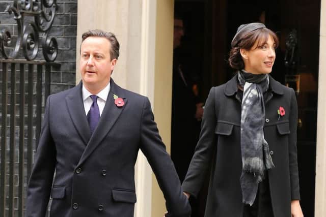 Prime Minister David Cameron and his wife Samantha walk through Downing Street on their way to the annual Remembrance Sunday service at the Cenotaph memorial in Whitehall, central London, held in tribute for members of the armed forces who have died in major conflicts. PRESS ASSOCIATION Photo. Picture date: Sunday November 8, 2015. See PA story MEMORIAL Remembrance. Photo credit should read: Chris Radburn/PA Wire