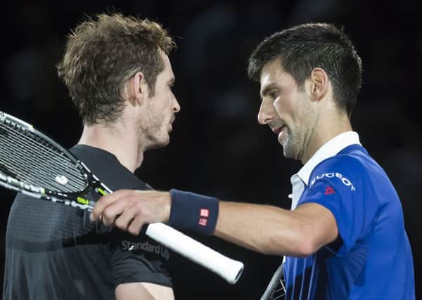 Britain's Andy Murray congratulates Novak Djokovic.