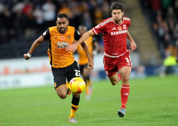RACE FOR THE LINE: Hull's Ahmed Elmohamady takes on Boro's George Friend at the KC Stadium.
 Picture: Jonathan Gawthorpe