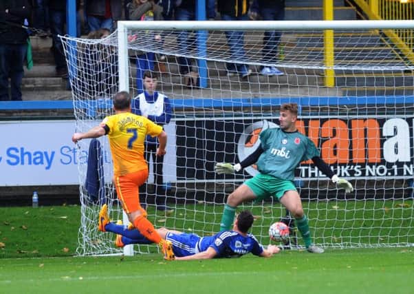 OPENING UP: Wycombe's Garry Thompson opens the scoring against FC Halifax Town on Sunday at The Shay. Picture: Jonathan Gawthorpe.