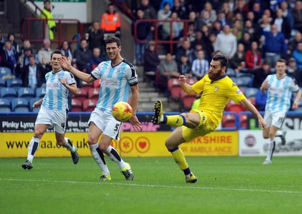 Leeds United's Mirco Antennuci scores opening goal against Huddersfield Town at John Smith's Stadium. Picture: Simon Hulme