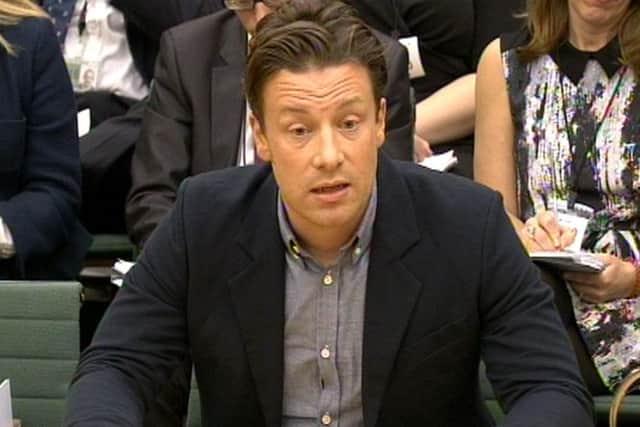 Celebrity chef Jamie Oliver answers questions in front of the Health Select Committee at the House of Commons, London in the subject of Child Obesity.