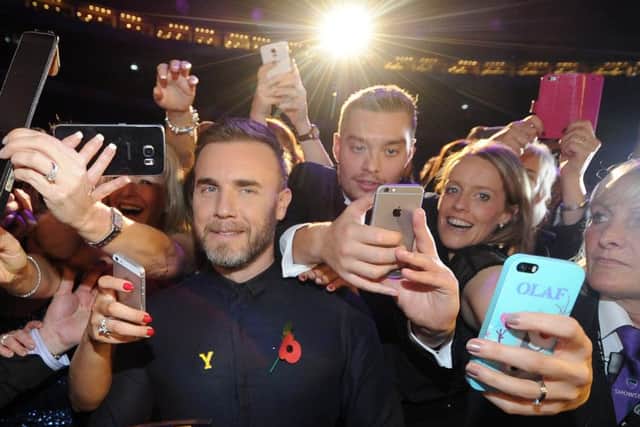 Gary Barlow celebrates with fans