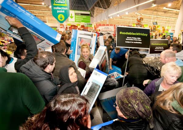 Shoppers at Asda in Pudsey, Leeds, queued in their hundreds from 7am for Asda's first 'Walmart style' Black Friday event and were welcomed by American cheerleaders