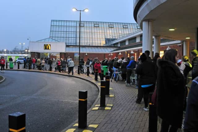 Shoppers queue up for bargains outside Asda on Black Friday 2014