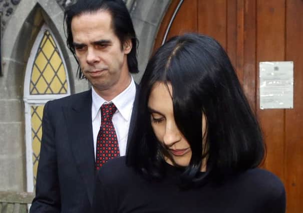 Musician Nick Cave and his wife Susie Bick leave Brighton Coroner's Court