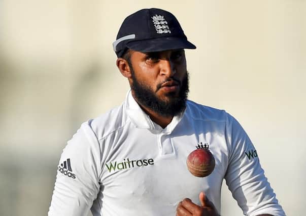 England's Adil Rashid leaves field after his five-wicket haul during the final day of first test match between Pakistan and England at Zayed Cricket Stadium in Abu Dhabi. (AP Photo/Hafsal Ahmed)