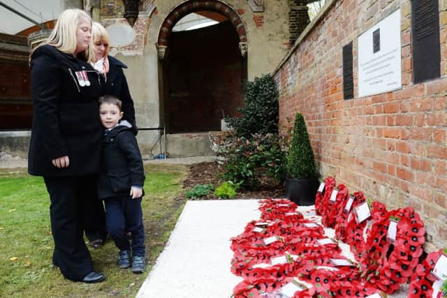 Rebecca Rigby (left), the widow of murdered Fusilier Lee Rigby, and son Jack as they attend a service at St George's Chapel in Woolwich, to mark Armistice Day.