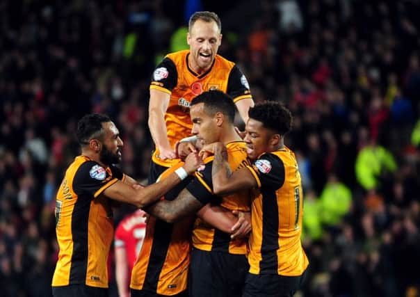 City players mob Tom Huddlestone after he scored their third goal. against Middlesbrough. (Picture: Jonathan Gawthorpe)