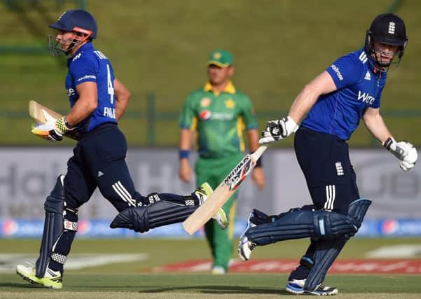 NOT ENOUGH: Captain Eion Morgan, right, and James Taylor's century partnership was the only highlight in England's defeat to Pakistan. AP Photo/Hafsal Ahmed.