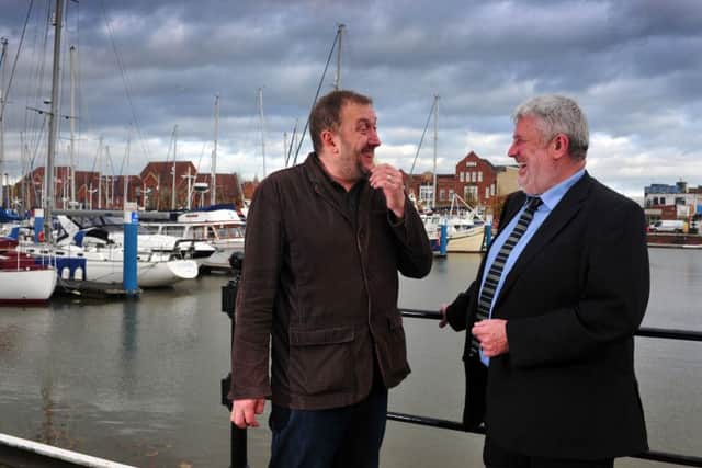 Phil Ascough, right, chair of the Hull Area Council for Hull Chamber of Commerce, chats to Russ Litten, organiser of the Humber Mouth Festival at the city's regenerated Marina. Picture: Tony Johnson.
