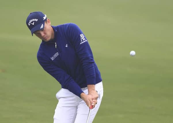 Danny Willett of England hits a shot on the 14th hole during the first round of the BMW Masters golf tournament at the Lake Malaren Golf Club in Shanghai. (AP Photo)