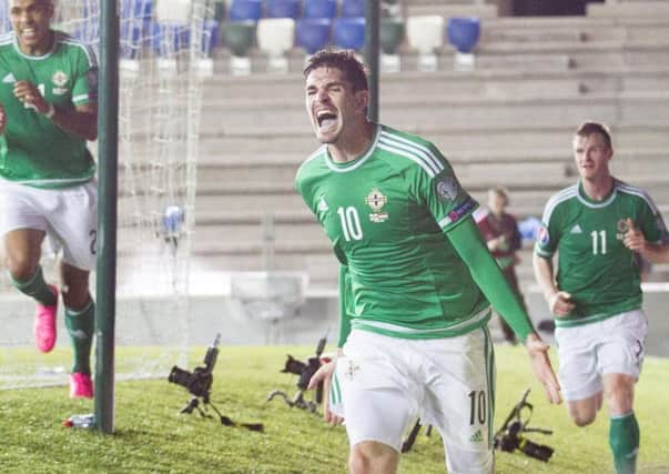 Kyle Lafferty celebrates scoring for Northern Ireland.