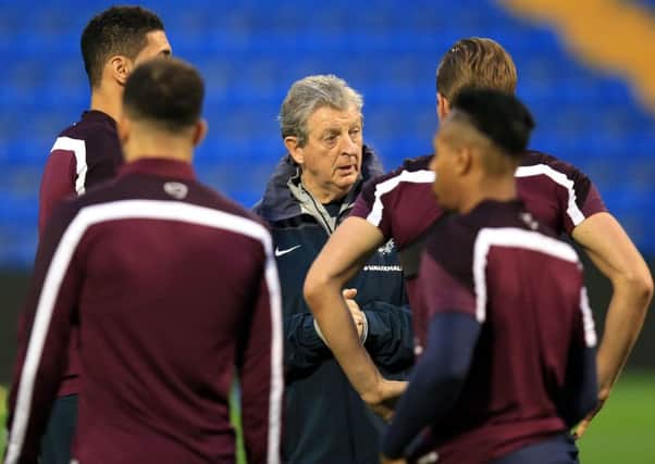 England manager Roy Hodgson talks to his players during a training session at the Rico Perez Stadium, Alicante.