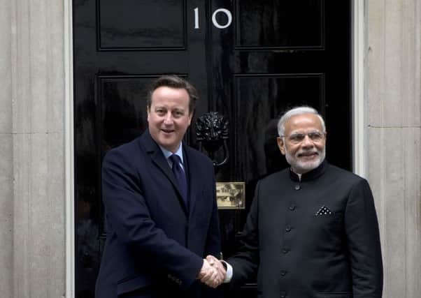 Indian Prime Minister Narendra Modi is greeted by Prime Minister David Cameron outside 10 Downing Street in London, at the start an official three day visit. PRESS ASSOCIATION Photo. Picture date: Thursday November 12, 2015. The visit of Mr Modi will see the two countries try to develop their relationship even further with billions of pounds worth of commercial deals due to be signed over the coming days. Hannah McKay/PA Wire